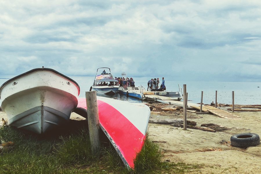 Boats with people on the beach